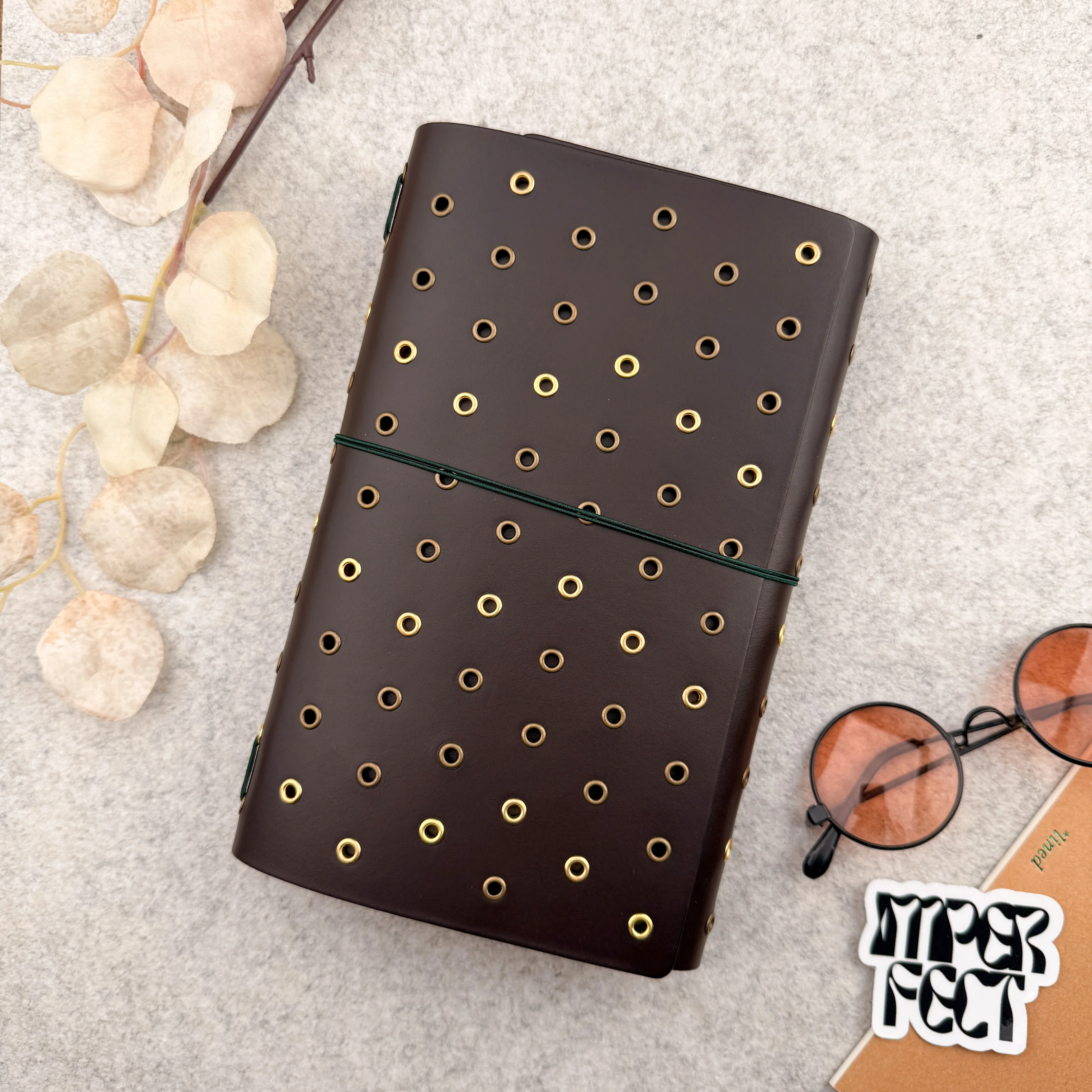 Imperfect Concepts Dancer Leather Notebook - A5 Trifold - Dark Brown w/ Gold & Brass Grommets
