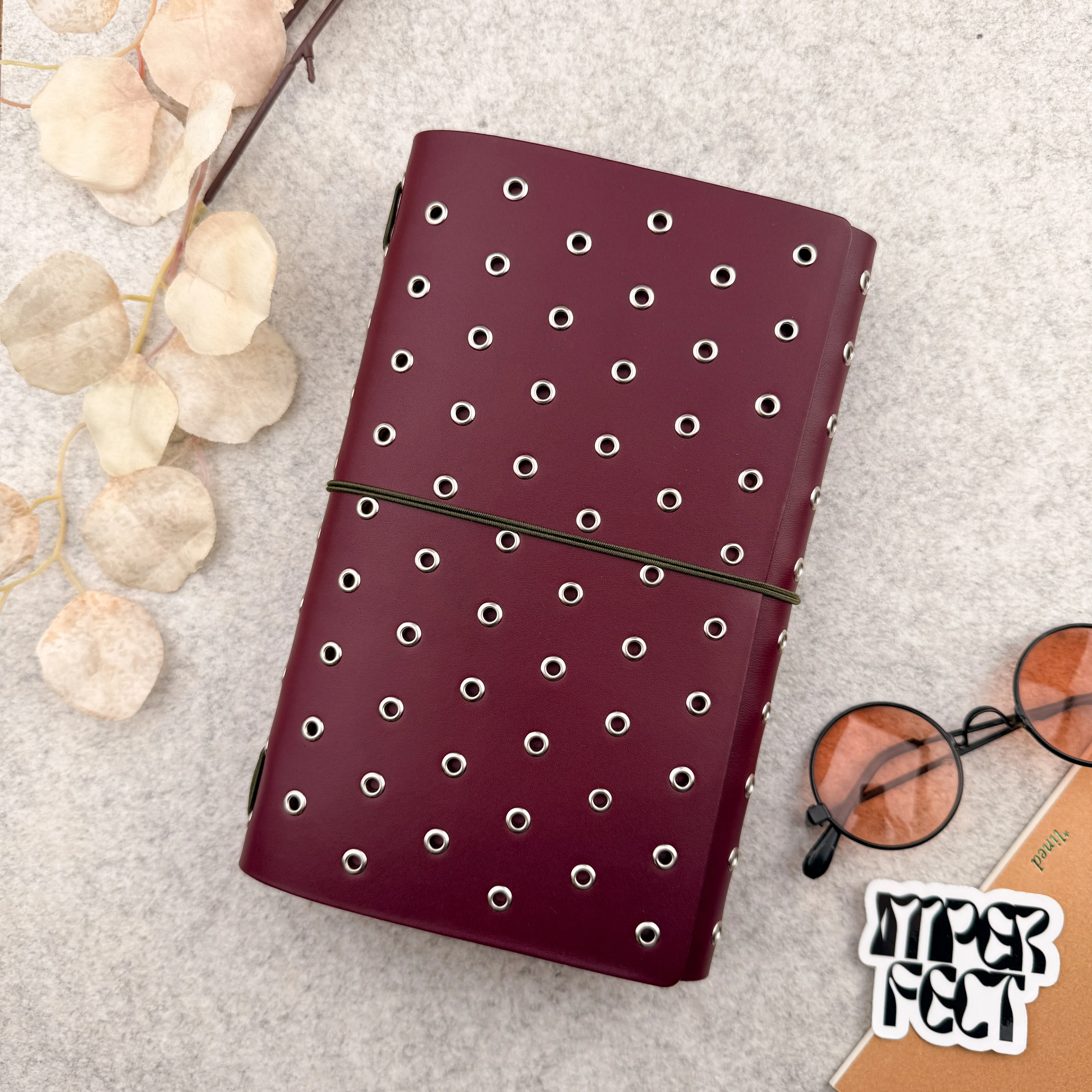 Imperfect Concepts Dancer Leather Notebook - A5 Trifold - Maroon w/ Silver Grommets